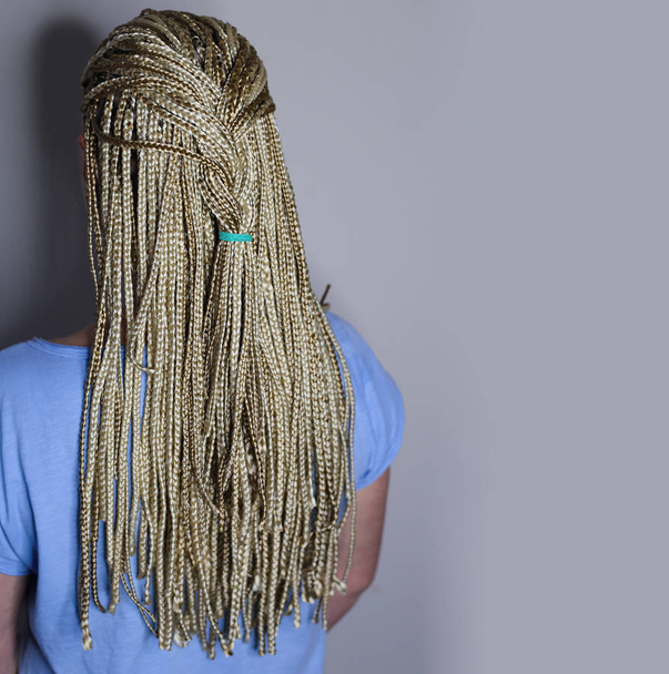 many african thin braids braided on the head of a blond girl, on - Photo, Image