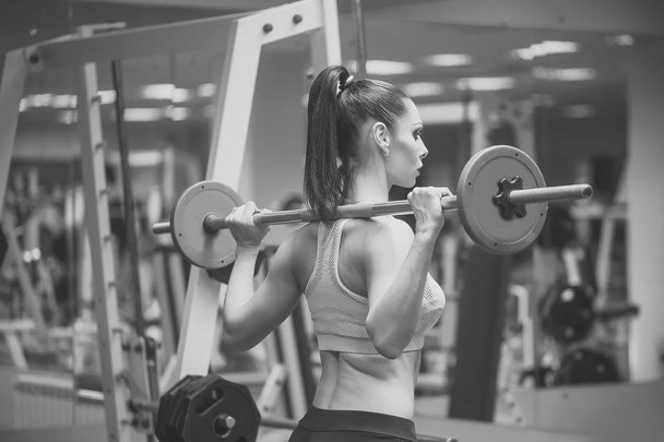 Female fitness. Sexy girl in gym - Foto, imagen