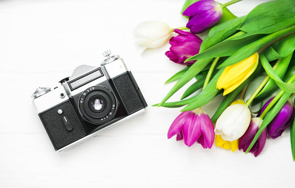  flowers gift and camera on a white background - Photo, Image