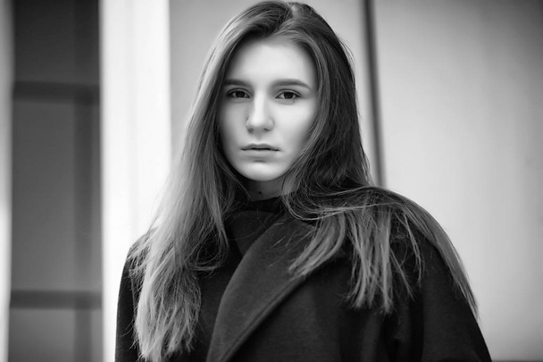 Girl in a coat black and white photo - Fotoğraf, Görsel