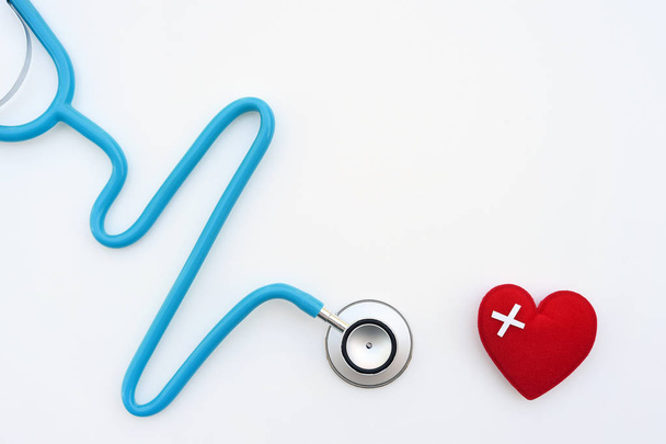 Red heart with stethoscope isolated on white background - Photo, Image
