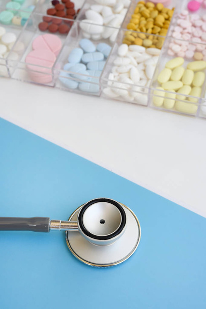 Different medication with stethoscope for background - Foto, afbeelding