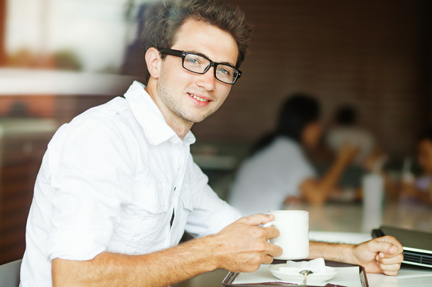 Man in cafe with coffee - Фото, зображення