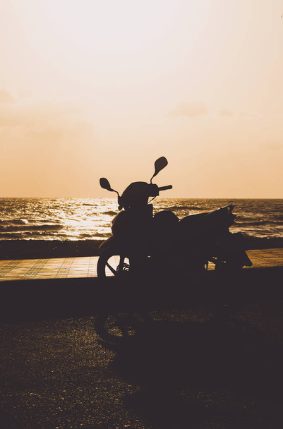 silhouette motorcycle in the morning - Фото, изображение