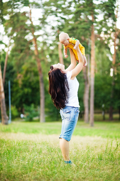 young mother with infant baby outdoors - Photo, image
