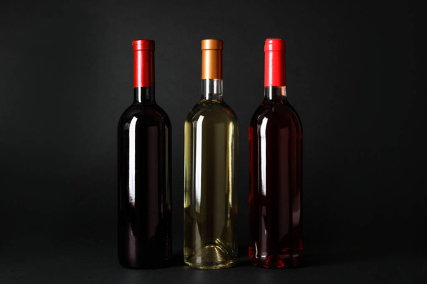 Bottles of expensive wines on dark background - Foto, Imagem