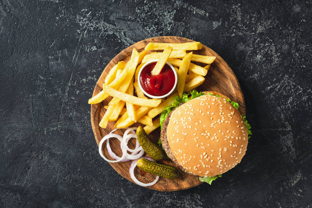 Burger, hamburger or cheeseburger served with french fries, pickles and onion - Zdjęcie, obraz