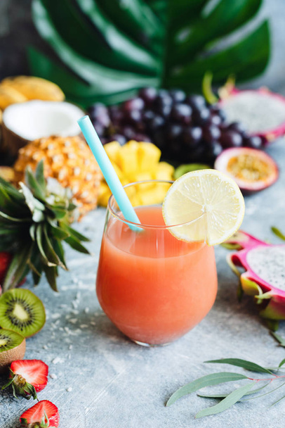 Tropical juice or cocktail in a glass - Фото, изображение