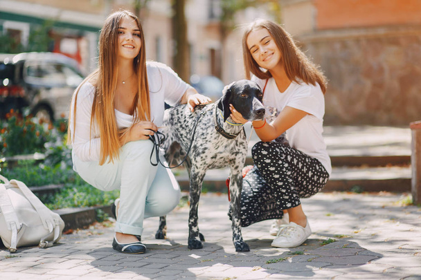 girls with dog - Φωτογραφία, εικόνα