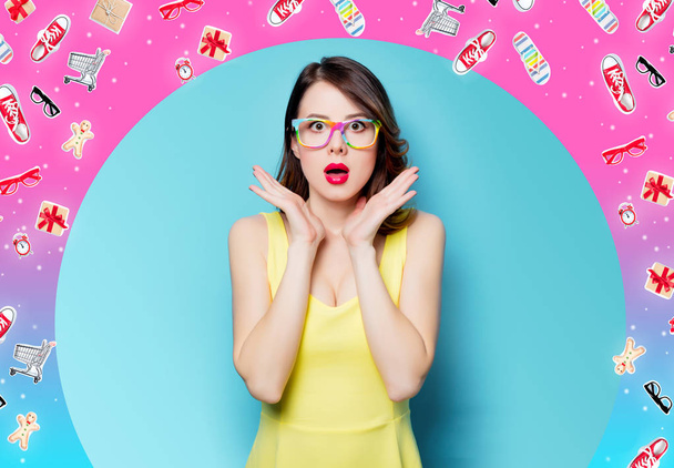 young surprised woman in glasses with clothes - Photo, Image