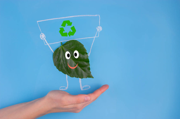 green leaf character holding poster. environmental concept - Φωτογραφία, εικόνα