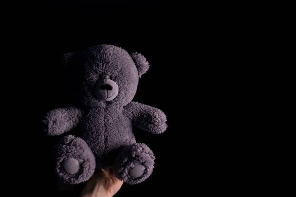 teddy bear in handcuff. Child abuse and violence concept. - Фото, зображення