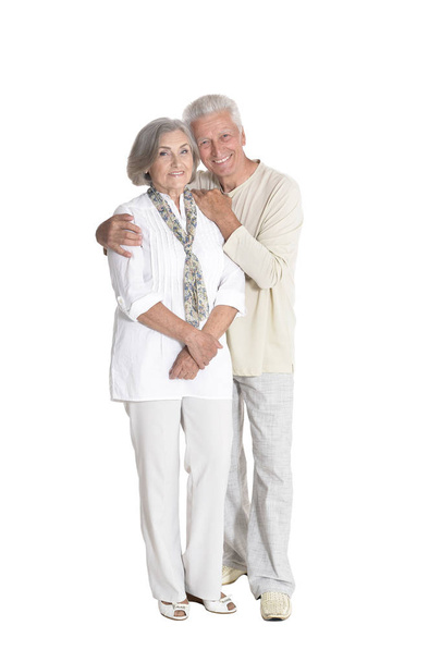 Full length portrait of  senior couple embracing  isolated on white background - Fotografie, Obrázek