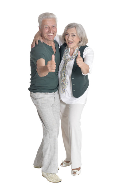 Full length portrait of  senior couple with thumbs up  isolated on white background - Photo, image
