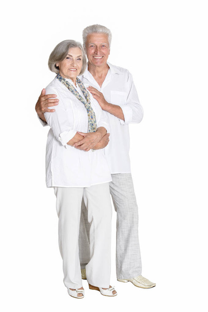 Full length portrait of  senior couple embracing  isolated on white background - Fotoğraf, Görsel