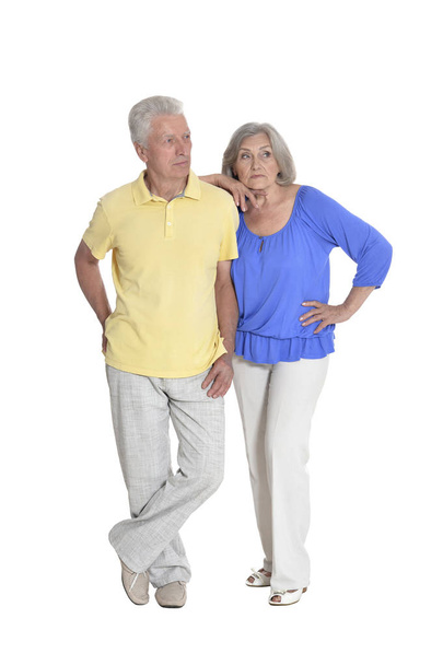 Full length portrait of  senior couple embracing  isolated on white background - Фото, изображение