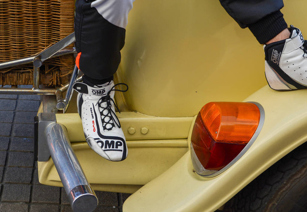 LE MANS, FRANCE - JUNE 16, 2017: The details of shoes and racing uniform of one of racer at a parade of pilots racing 24 hours - Φωτογραφία, εικόνα