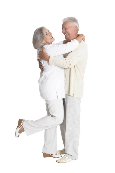 Full length portrait of  senior couple dancing   isolated on white background - 写真・画像