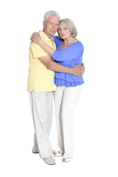 Full length portrait of  senior couple embracing  isolated on white background - Photo, image