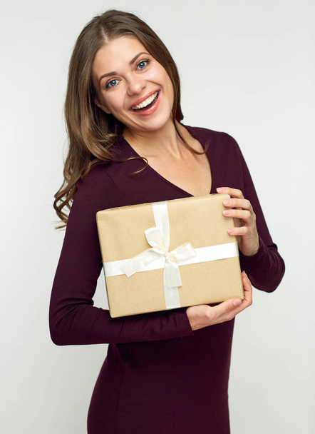 Happy woman holding gift box isolated on white background - Photo, image