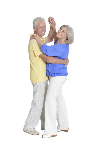 Full length portrait of  senior couple dancing   isolated on white background - Fotó, kép
