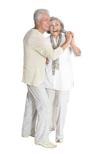 portrait of  senior couple singing  isolated on white background, full length - Valokuva, kuva