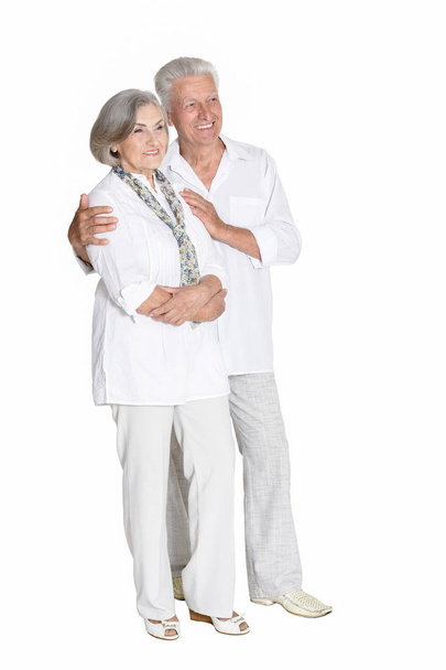 portrait of  senior couple hugging  isolated on white background, full length - Zdjęcie, obraz