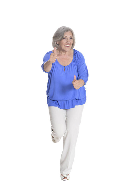 full length, happy senior woman with thumbs up,  isolated on white - Foto, Imagen