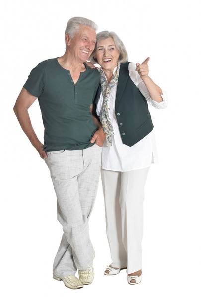 portrait of  senior couple showing something   isolated on white background, full length - Foto, Imagem