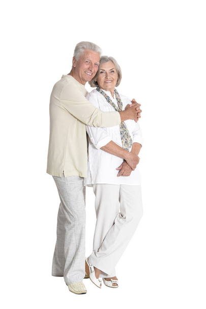 portrait of  senior couple hugging  isolated on white background, full length - Foto, imagen