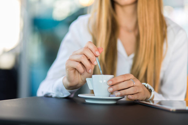 Closeup of a woman having a coffee in a bar - Fotografie, Obrázek
