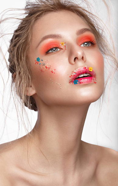 Beautiful girl with art make-up and flowers. beauty face. - 写真・画像