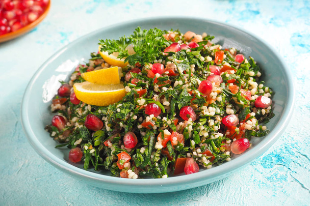 A plate of tabbouleh salad, close-up. Traditional Arabic food. - Photo, Image