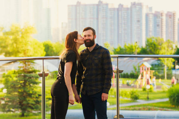 Beautiful romantic couple in love dating outdoors cityscape background - Fotografie, Obrázek