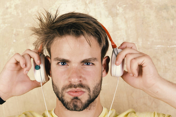 Music in the headphones. American handsome bearded guy with headphones. - Foto, Imagem