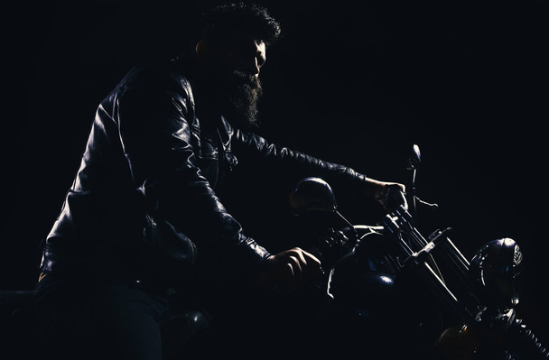 Night rider concept. Hipster, brutal biker in leather jacket riding motorcycle at night time, copy space. - Foto, immagini