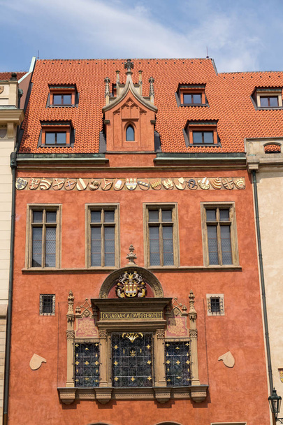 Old Town Hall with Praga Caput Regni  the capital of the realm inscription on beautiful renessaince window, House Kriz, Old Town Square, Prague, Czech Republic, UNESCO World Heritage Site, sunny day - Fotó, kép
