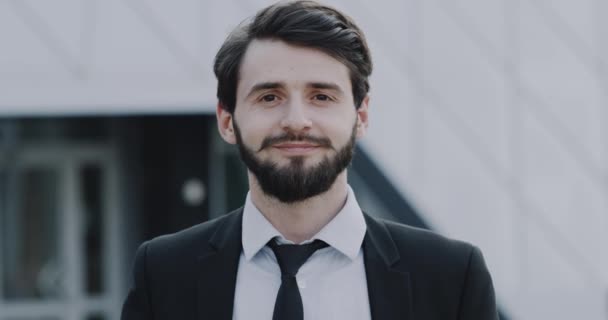 Charismatic young businessman looking with happy face in front of the camera. - Záběry, video