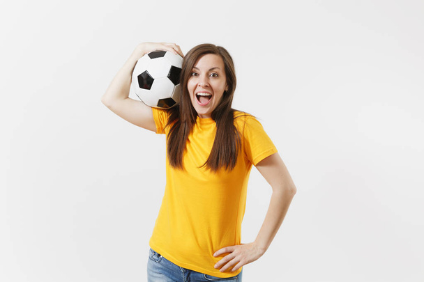 Счастливая европейская молодая женщина, футбольный фанат или игрок в желтой форме, держа футбольный мяч поддержки любимой команды изолированы на белом фоне. Спорт, играть в футбол, болеть, болельщики люди концепции образа жизни
 - Фото, изображение