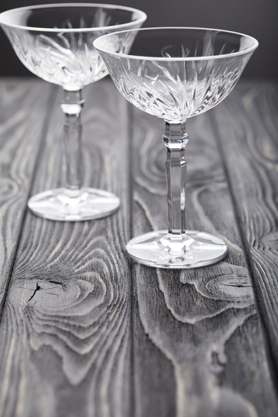 two empty glasses on grey wooden tabletop  - Zdjęcie, obraz