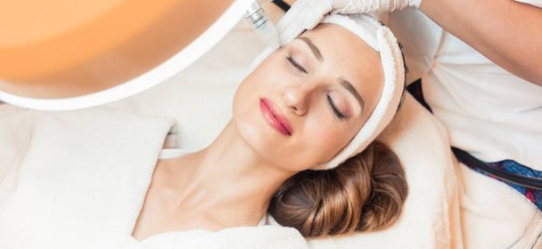 Close-up of the face of a woman relaxing in a modern beauty center - Photo, Image