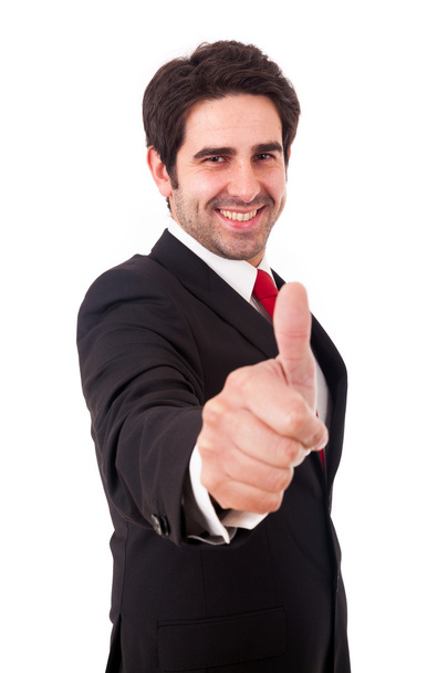 Smiling young business man with thumbs up gesture, isolated over - Fotó, kép