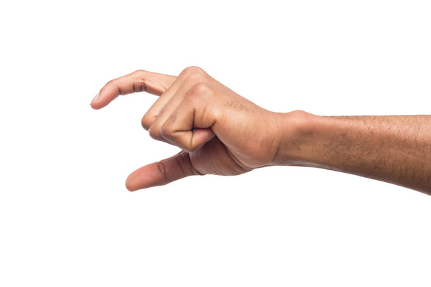 Mão masculina medindo algo, recorte, gesto
 - Foto, Imagem