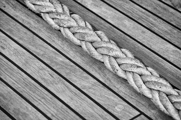 Thick rope on an old sailing ship wooden deck, selective focus. - Photo, Image