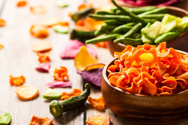 Dried vegetables chips from carrot, beet, parsnip and other vegetables . Organic diet and vegan food. - 写真・画像