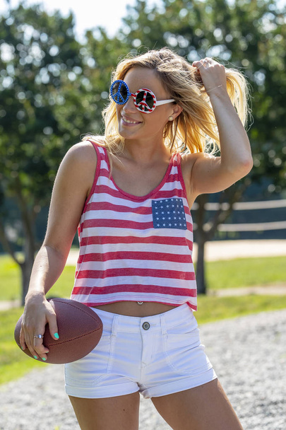 A patriotic blonde model having fun during the 4th of July holiday.   - Photo, Image