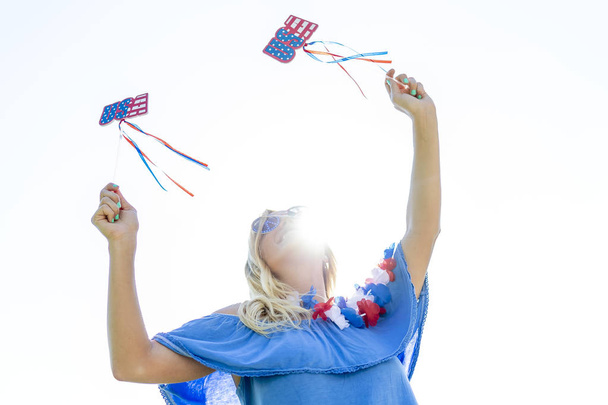 A patriotic blonde model having fun during the 4th of July holiday.   - Photo, Image