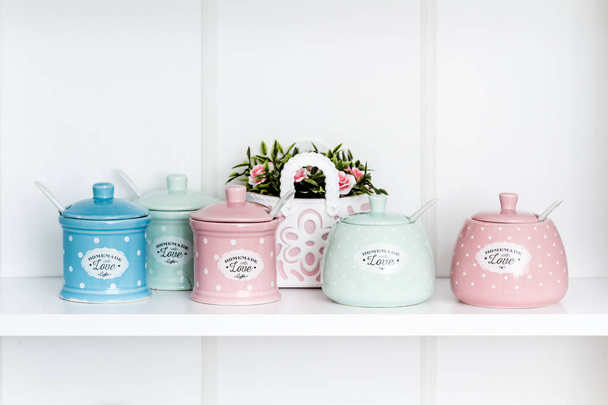 Decorative ceramic spice set with flower bag on white background - Foto, imagen