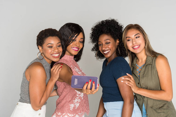 Group of four female minority friends spending time together - Photo, Image