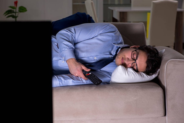 Businessman watching tv at night late - Photo, Image